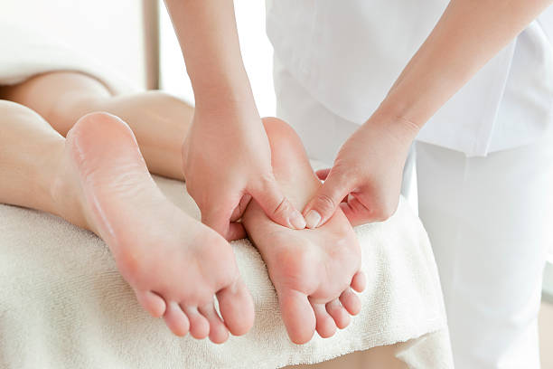 Relaxed patient enjoying Massage Therapy in Newmarket with reflexology