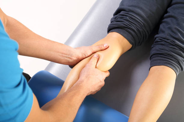 Sports massage therapist working on runner’s legs in Vaughan