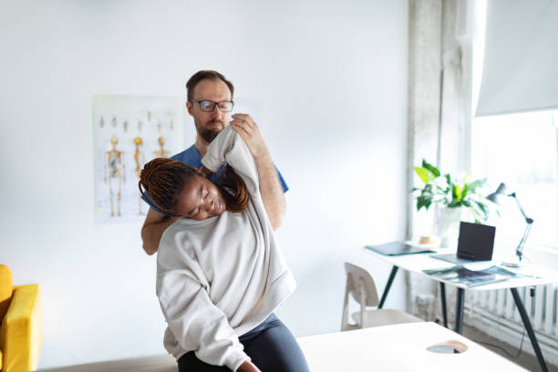 Chiropractor in Newmarket adjusting an office worker to improve posture and relieve neck and back pain