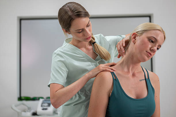 Chiropractor in Newmarket performing neck adjustment for pain relief