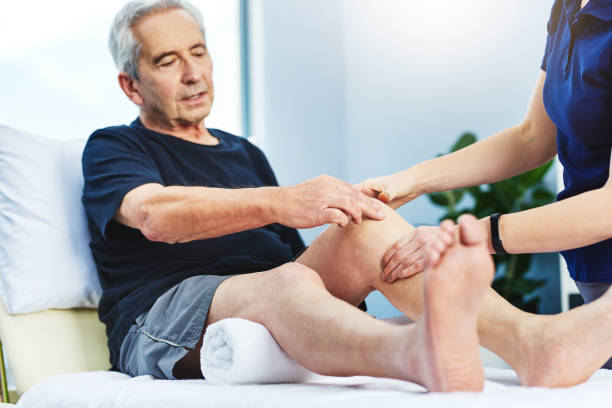Massage therapist providing gentle joint relief to an arthritis patient in Vaughan clinic