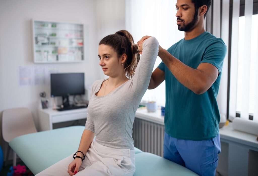 A Physiotherapist in Vaughan examining a young woman