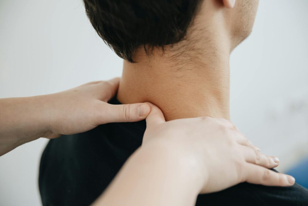 Chiropractor in Vaughan performing neck pain treatment on a patient at PhysioChiroWellness clinic
