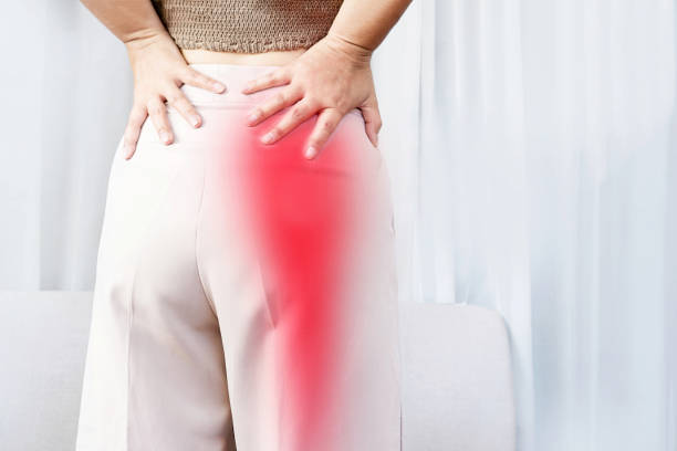 Physiotherapist in Newmarket assessing a patient with lower back and leg pain consistent with sciatica at PhysioChiroWellness clinic