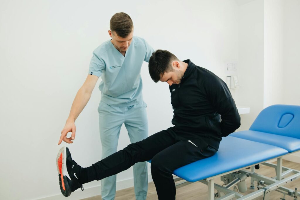 Physiotherapist in Vaughan assessing a patient's lower back for sciatica treatment