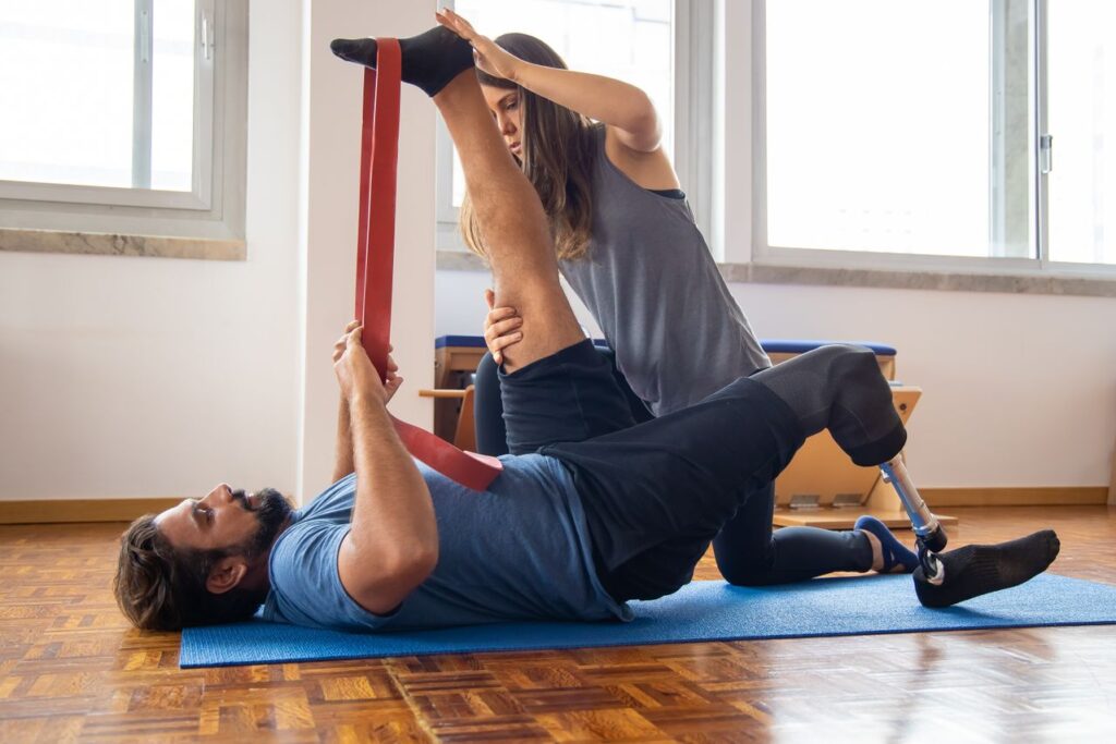 Physiotherapy clinic in Newmarket helping an injured worker with guided exercise for a workplace back injury
